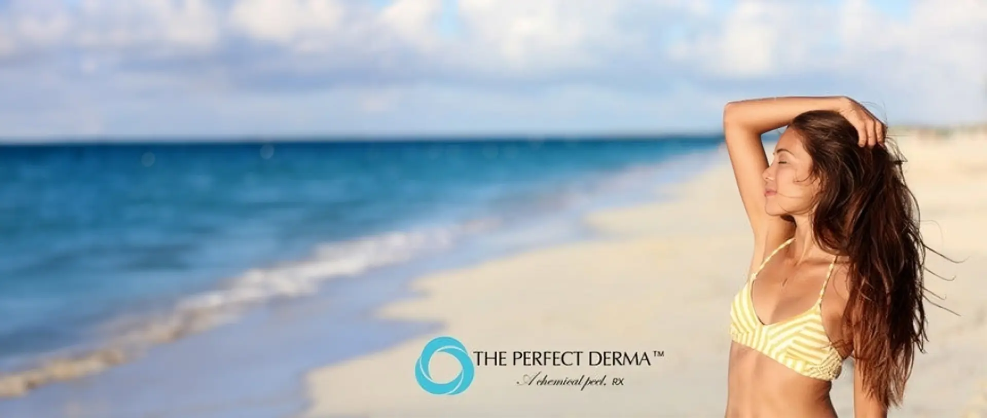 A beach with the logo of the perfect derma